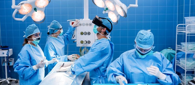 Surgeons performing operation in operation room at the hospital